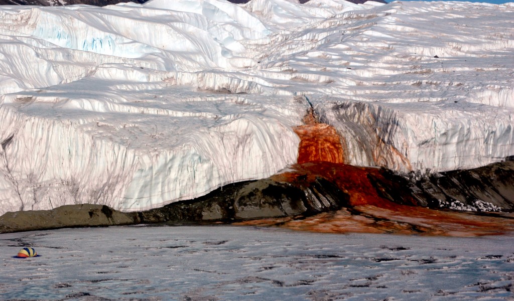 The Blood Falls in Antarctica, falling from the Taylor Glacier into Lake Bonney. Tent provided for size comparison. (Peter Rejcek / National Science Foundation)