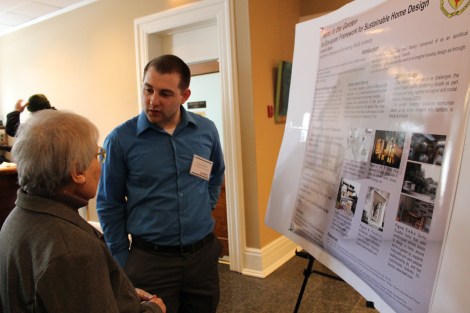 Cameron Butler explains his research to engaged guests at NiRC 2014. (Deborah Baremberg / Freelance photographer)